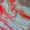 colorful light-weight crochet baby blanket on a table