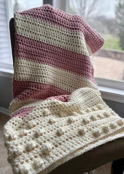 chunky pink and white stripe crochet blanket with bobble detailing