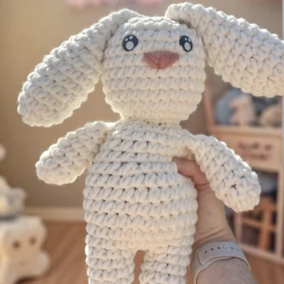 White bunny crochet plushie in a child's room