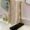 crocheted hand towel in neutral tones by a sinnk