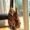 cotton crochet tote in earth colored tones hanging on chair
