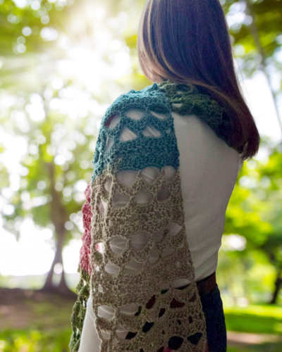 lacy crochet extra long multi-colored scarf on woman