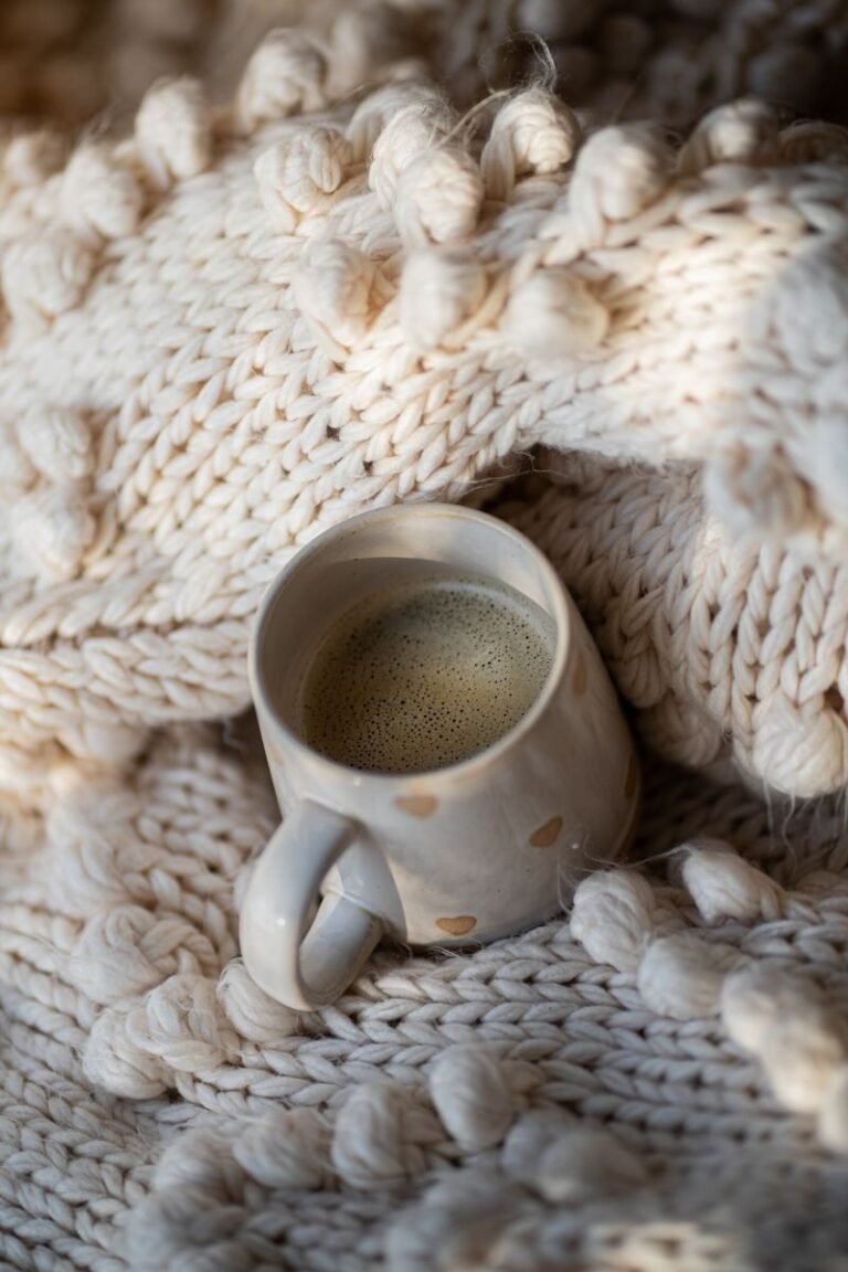 cozy crochet self-care setup with crochet comfy blanket and coffee